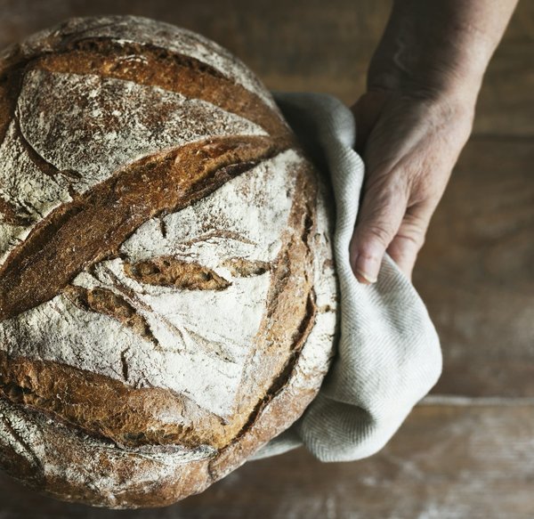 How to Bake an Artisanal Sourdough Bread with a Crusty Exterior and Chewy Interior?